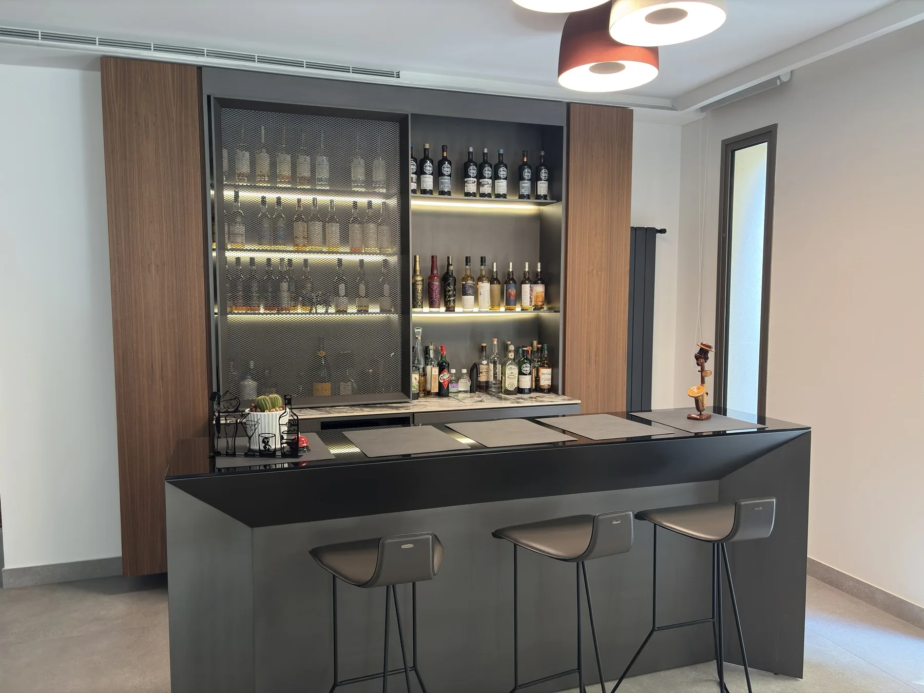 Hazmiyeh Residence — walnut and steel-mesh home bar